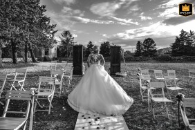 Bride showing the beautiful lace back of her dress as she runs down the aisle at Palazzo dei Capitani in Forlì, Italy.